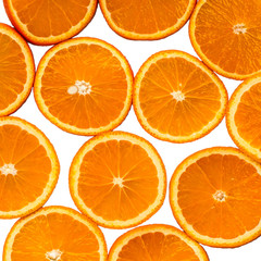 cut round slices of orange on white background