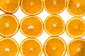 cut round slices of orange on white background