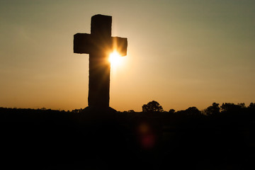Light Bursts Behind a Cross