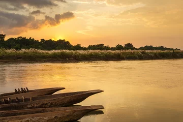 Foto op Plexiglas Sunset over the Rapti river in Sauraha. © Tomasz Wozniak