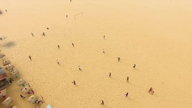Football game on Africa beach, aerial