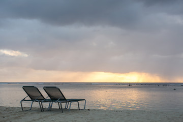 beach chair on the beach with sunset