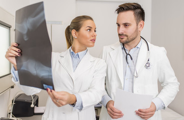 Doctors examining an x-ray of the patient