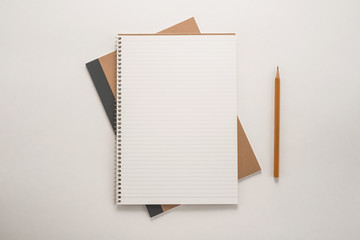 Notepad with a pencil on the table