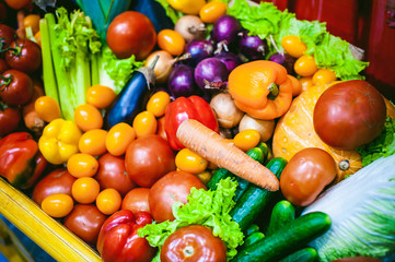 Assorted raw vegetables and fruits background.