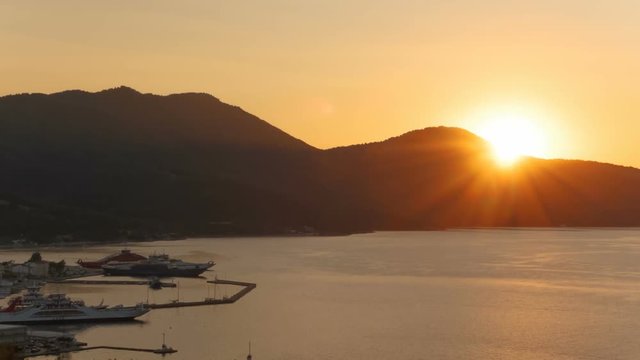 Telephoto sunset shot of the old port of Limenas, the Greek island of Thassos, Greece in the North Aegean Sea, the northernmost Greek island