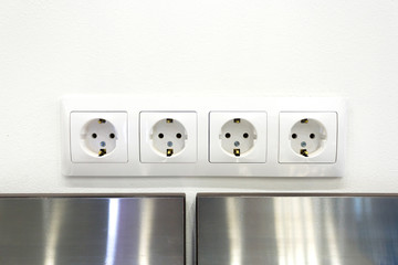 Four european sockets on a wall