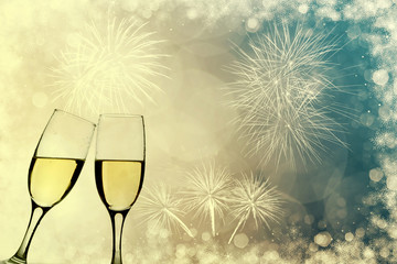Champagne glasses on sparkling background