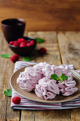 Fototapeta na wymiar Raspberry Zephyr on a plate with fresh raspberries and mint