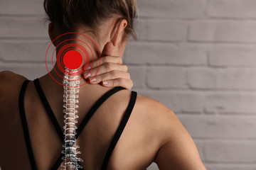 Woman suffering from back and neck pain. Incorrect sitting posture problems, Muscle spasm, rheumatism. Pain relief , chiropractic concept. Sport exercising injury - obrazy, fototapety, plakaty
