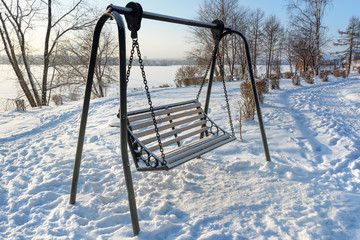 Empty street swing in winter
