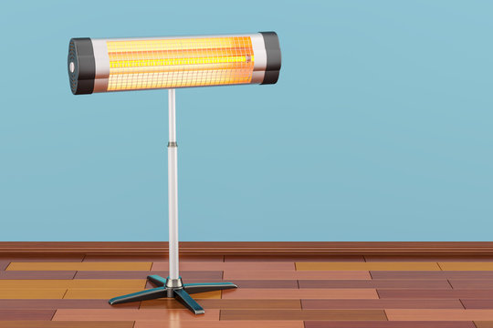 Halogen or infrared heater on the wooden floor. 3D rendering