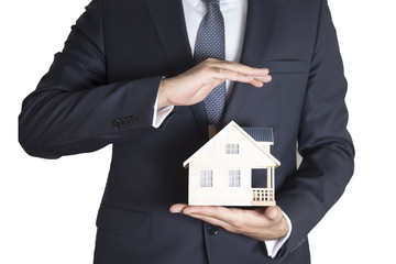 Buying new real estate concept, house and key on hand. Protect Your Home Concept 