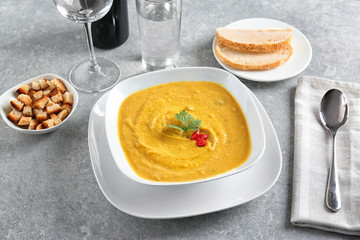 Bowl of homemade lentils creme soup on table