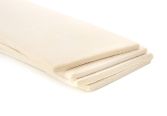 Fresh raw puff dough, isolated on white