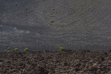 Volcanic rock from lava flow macro. Lava field in Timanfaya National Park in Lanzarote, Canary Islands, Spain.