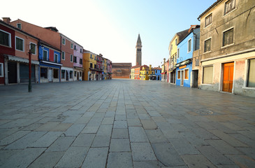 wide street of Burano Island near Venice in ITALY in the early morning