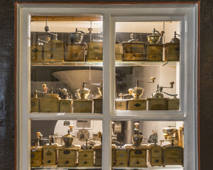 Ancient coffee grinders in a window of the old medieval house in Germany.