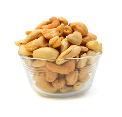 Cashew nuts in glass bowl on white background