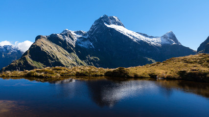Naklejka na ściany i meble Mountain view and water reflection from the Mackinnon Pass on the Milford Track, New Zealand