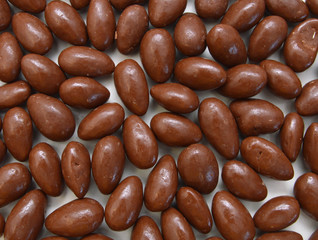 Dark brown Chocolate balls on background