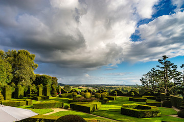 Regular garden in little french castle, sunset time