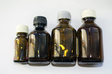 Small brown glass jars