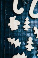 Preparing Christmas cookies as gift, gift's over a black background, top view.