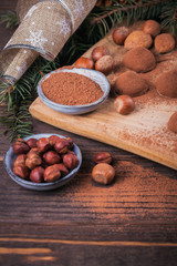 Homemade chocolate truffles, nuts, almonds and cocoa powder