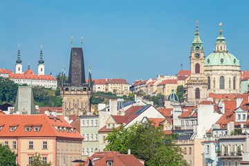 Naklejka na ściany i meble Lesser Town Bridge Towers and St. Nicholas Church at the Mala Strana in Prague, Czech Republic, in the morning