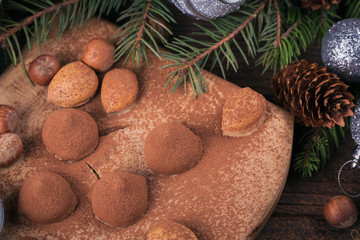 Homemade chocolate truffles, nuts, almonds and cocoa powder