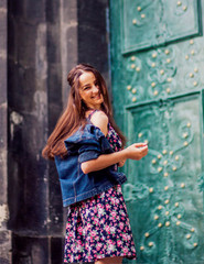 Fototapeta premium Wonderful girl walking along the street