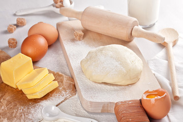 Dough preparation recipe for bread, pizza, pasta, cookies or pie ingridients, food flat lay on kitchen table background. Working with butter, milk, yeast, flour, eggs, sugar pastry or bakery cooking.