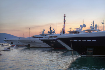 Big yachts in marina at sunset