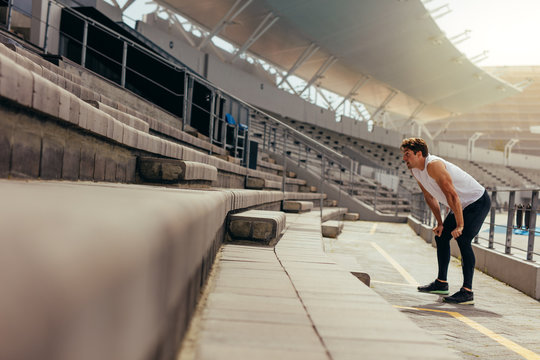 Athlete working out in the stands of a stadium