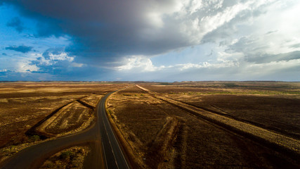 Fototapeta na wymiar Aerial View Stormy Sky Country Road Outback Western Australia, Australia