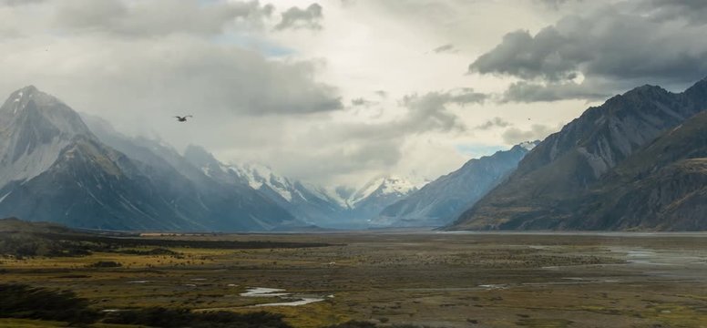 NEW ZEALAND – MARCH 2016 : Animated shot of beautiful landscape in Glentanner / Mount Cook National Park with bird flying in view