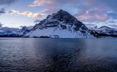 Fototapeta na wymiar Canadian Rockies reflected in Bow Lake before sunrise in Banff National Park, Alberta