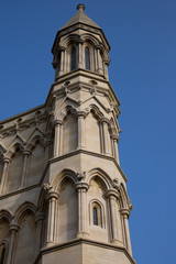Fototapeta na wymiar Cathedral tower on blue sky