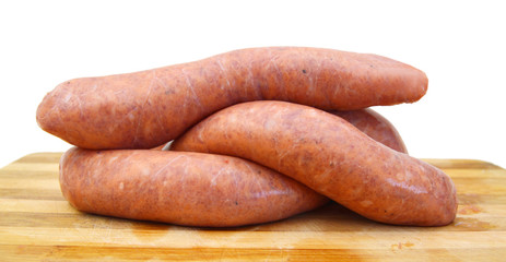 Raw sausage on white background 