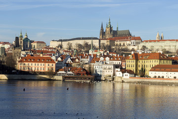 Naklejka na ściany i meble View on the winter Prague gothic Castle above River Vltava, Czech Republic