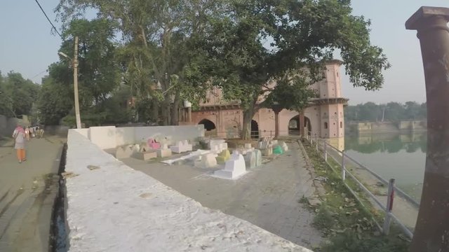 Ancient architechture and shrines for sages in North India. Smooth tracking shot, 4X slow motion. Wide angle.mov
