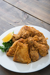 fried chicken with lemon and parsley