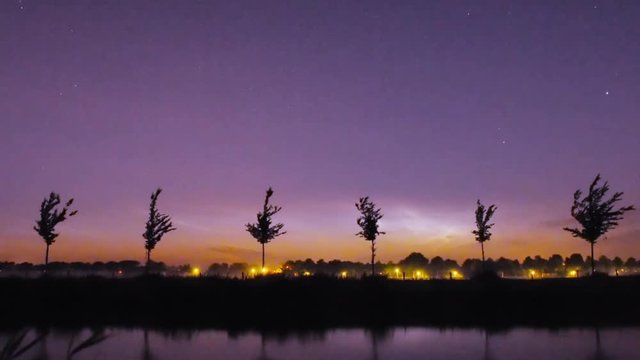 noctilucent clouds NLC over Noordhollandsch Kanaal canal summer midnight twilight timelapse 