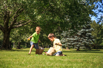 children looking for Easter eggs in the grass. the concept of Easter eggs hunting