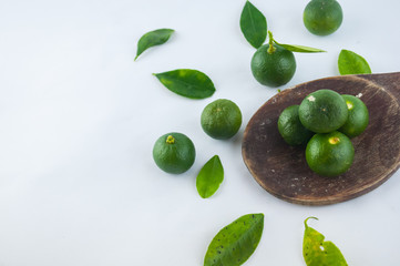 Lime. Fresh fruit with leaf isolated on white background.