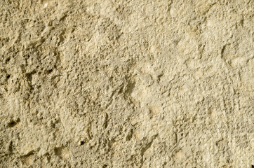 Old stone weathered wall closeup