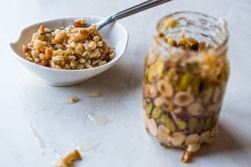 Honey Flavored Nuts, Almonds and Peanut Brittle Dessert in Jar