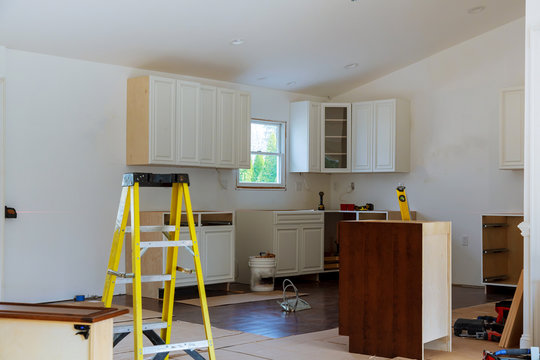 Installation of kitchen cabinet.