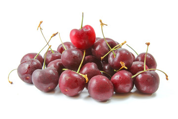 A close up of three red cherries